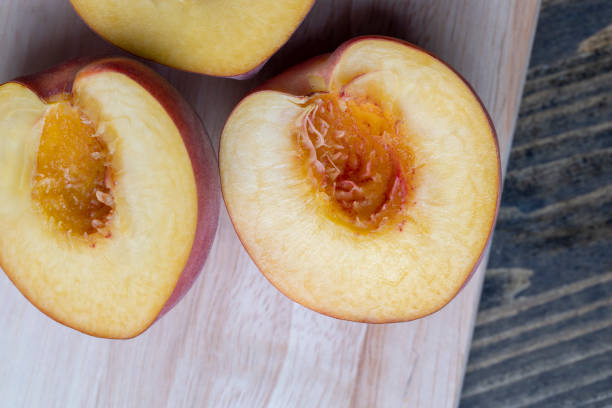istock Ripe fresh peaches on a wooden table 1598353532