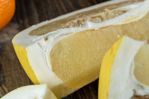 istock ripe yellow pomelo cut into pieces close-up 1598353551