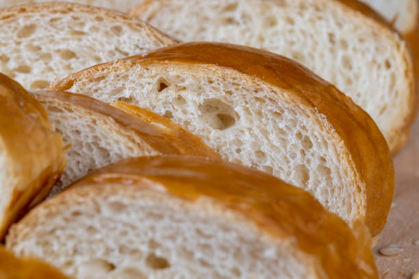 Wheat baguette on a wooden cutting board