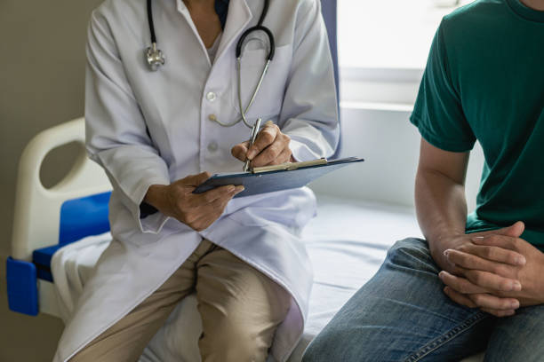 istock doctor and patient discussing symptoms Discuss problems with patients about medicines and treatment methods, diagnose, sit down and talk. At the table near the window in the hospital medicine concept 1598362091