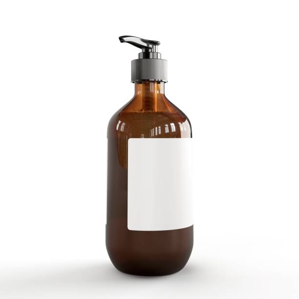 istock a brown liquid bottle with white label, on a light background 1598362626