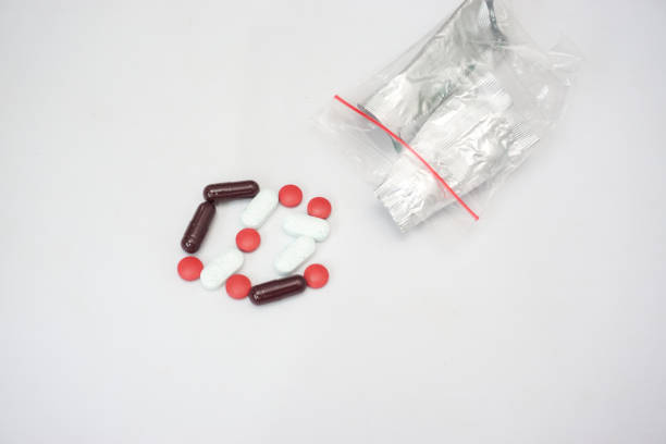 istock Red-white antibiotic capsule pills 1598371317