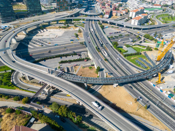 istock Aerial top view highway road network intersection, roundabout or circle for traffic transportation 1598380740