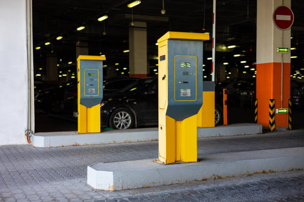 istock yellow parking meter in the car park. 1598387944