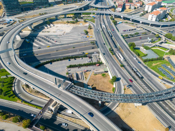 istock Aerial top view highway road network intersection, roundabout or circle for traffic transportation 1598387984