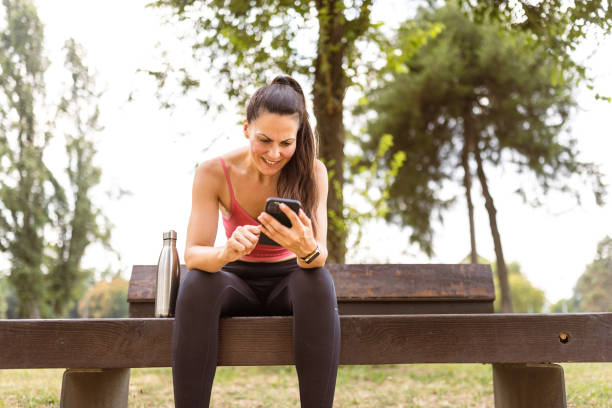 istock Woman jogging outdoors, hydrating 1598404638