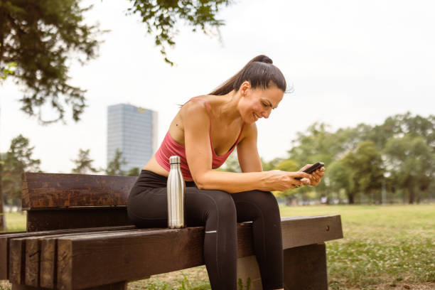 istock Woman jogging outdoors, hydrating 1598404639