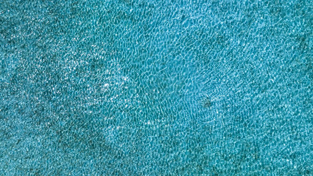 istock Tropical beach water  with crystal clear water on beach background 1598411098