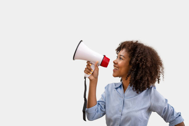 istock woman holding a megaphone. makes a powerful change. 1598411655