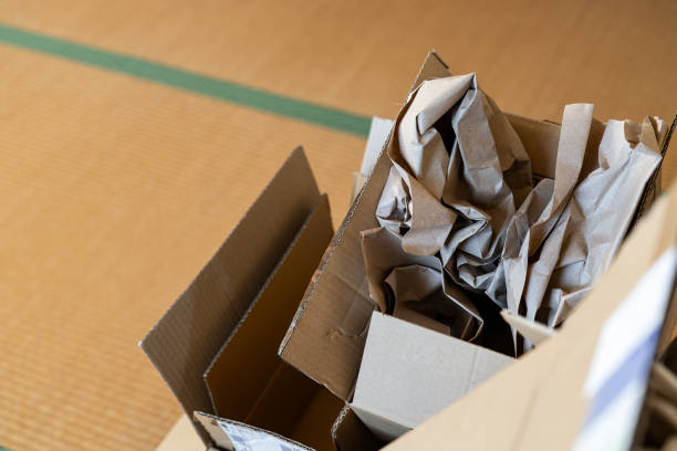 istock Cardboard boxes stacked in a room 1598431173