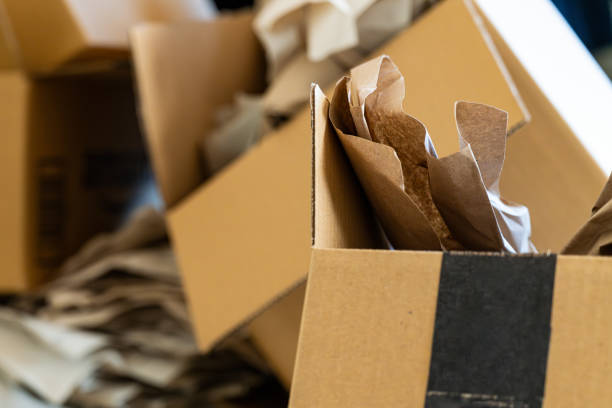 istock Cardboard boxes stacked in a room 1598431213