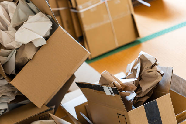 istock Cardboard boxes stacked in a room 1598431759