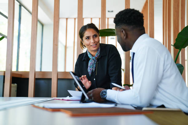 istock Diverse people working  on financial paperworks at the office 1598446907