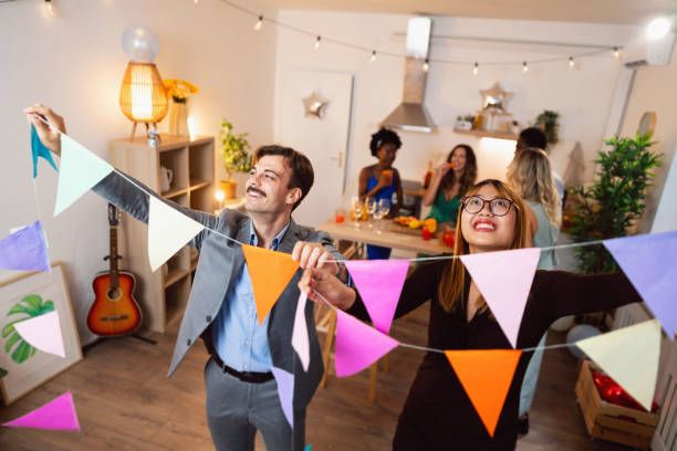 istock Multiracial people decorating house for the party 1598448592