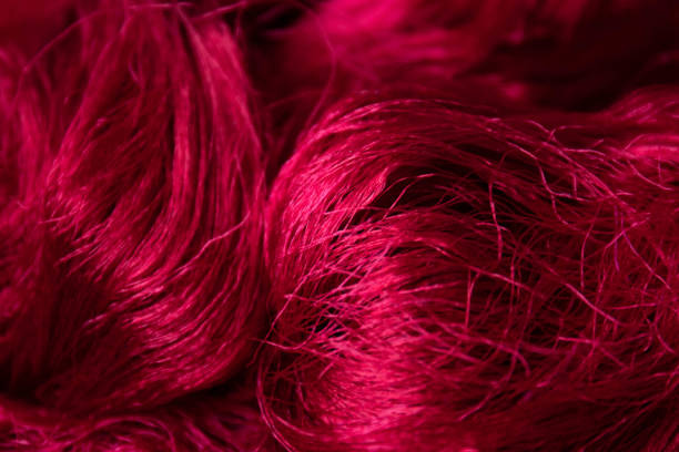 istock close up red silk yarn for background 1598450239