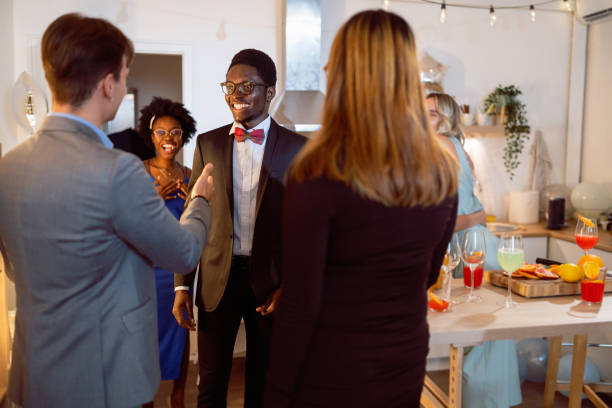 istock Multiracial people greeting each other while they arriving for a house party 1598455647