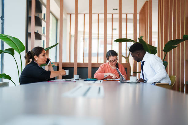 istock Diverse people working on meeting table at the office 1598457434