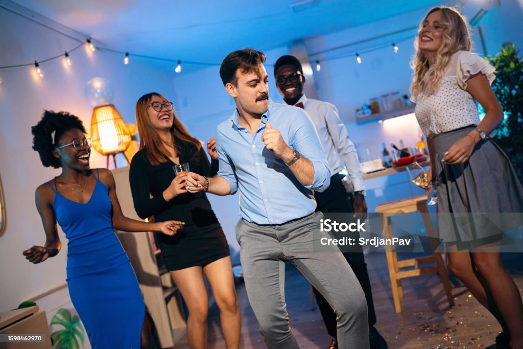 Fun Group Dancing Group Of Multiracial People Having Fun While Dancing During House Party ...