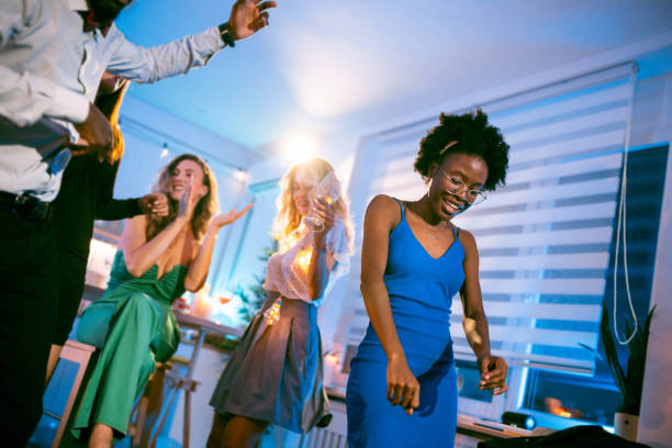 istock Multiracial people dancing and having fun during house party 1598475213