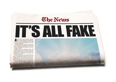 Newspaper front page about fake news. Text is lorem ipsum and photo and design are by the photographer, so this image is free of third-party copyright and may be used for any purpose.