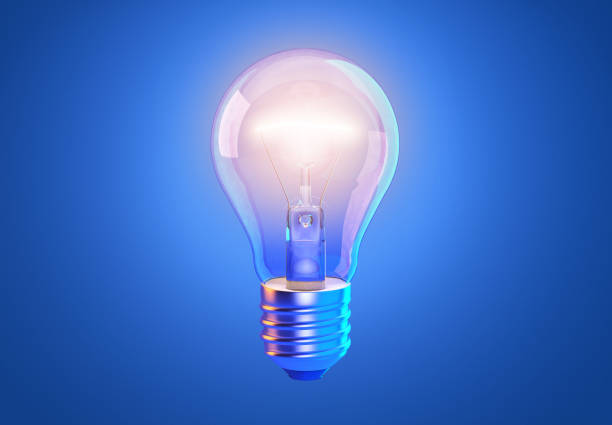 青の背景に透明なタングステンの輝く電球と輝く光