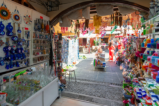 Rhodes Island, Greece - May 23, 2022: The famous Socrates market street in Old Rhodes Town, with shops selling touristic souvenirs next to each other.