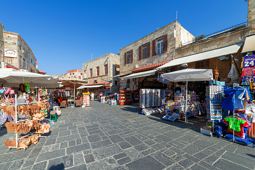 Street shops with clothes in city of Old Town on Rhodes island, Greece