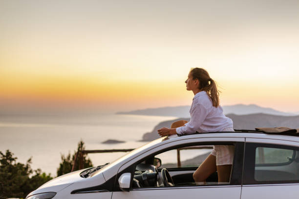 istock Woman enjoys the glorious summer scenery on her journey 1598528797