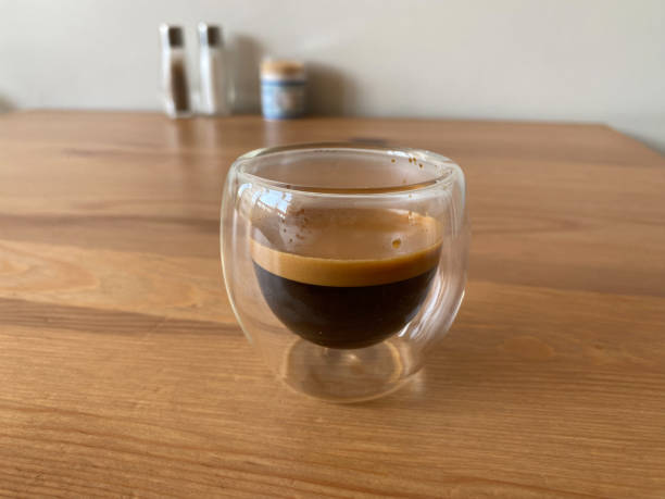 istock Transparent double wall glass mug with espresso. 1598534284