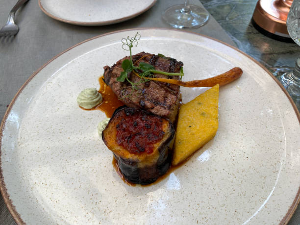 istock grilled beef steaks with eggplant and rosemary served at restaurant. 1598536532