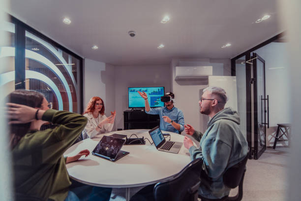 istock A diverse group of businessmen collaborates and tests a new virtual reality technology, wearing virtual glasses, showcasing innovation and creativity in their futuristic workspace 1598539693