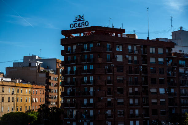 Spanish architecture building in the city center of Valencia in shadow during the warm sunset