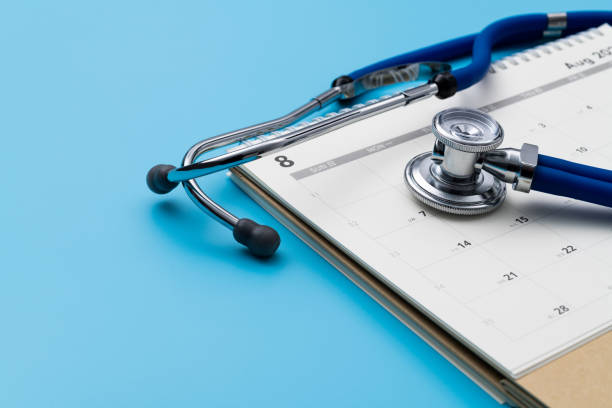 istock Stethoscope and pen on a calendar 1598563603