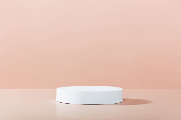 istock Abstract empty white podium on pink background. Mock up stand for product presentation. 3D Render. Minimal concept. Advertising template 1598567939