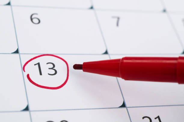 istock Red mark on the calendar at number 13 1598569578