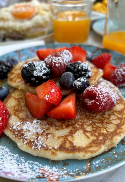 istock Breakfast with pancake with maple syrup And red fruits 1598577011