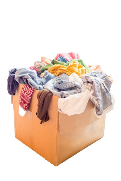 istock Pile of clothes in a large cardboard box 1598578713