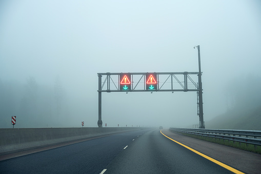 Multi-lane highway in dense fog