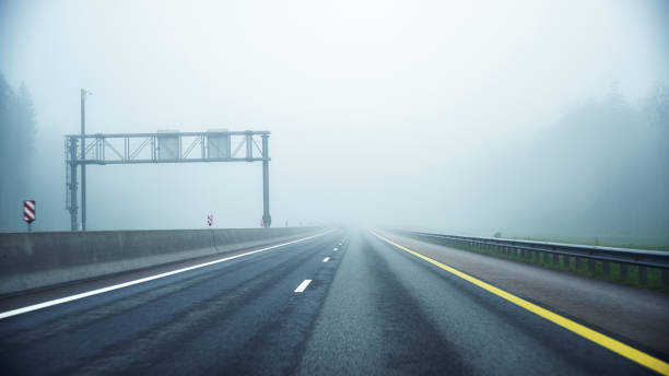 istock Multi-lane highway in dense fog 1598582534
