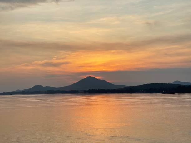 istock Beautiful sunset over the ocean with mountains in the background 1598592957