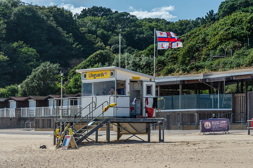 Middle Chine, Bournemouth, UK - July 12th 2023: RNLI  flag flying over the lifeguard watch post.