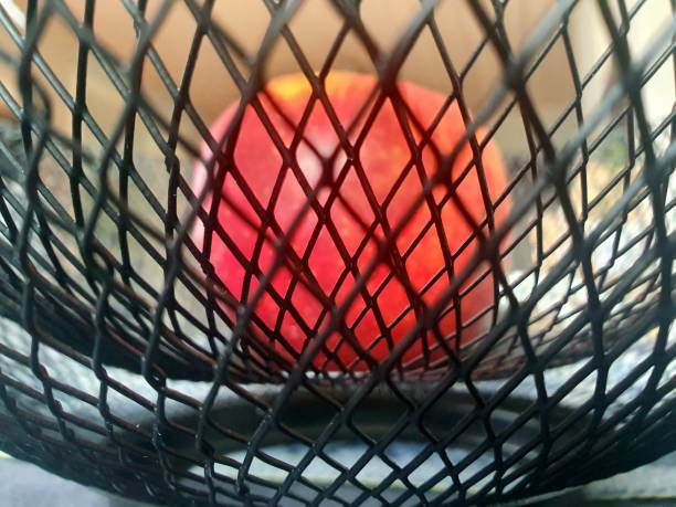 istock Apple in a metal basket 1598617058