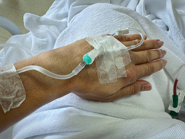 istock Intravenous injection on Patient's Hand Through Bloodstream 1598621950