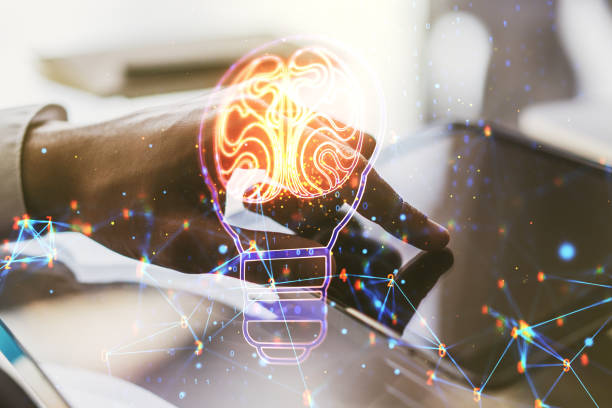 istock Creative light bulb illustration with human brain and with finger presses on a digital tablet on background, future technology concept. Multiexposure 1598624680
