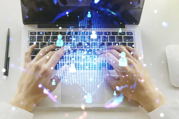 istock Social network media concept with world map and hands typing on computer keyboard on background. Double exposure 1598627010