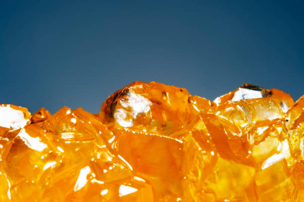 istock Sweet orange sugar crystals close up. Fruit sweets. 1598632097