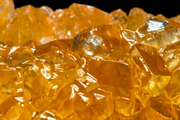 istock Sweet orange sugar crystals close up. Fruit sweets. 1598632101