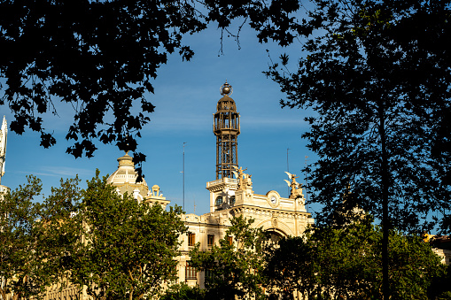 Early morning light of daybreak illuminating the iconic Moorish and Renaissance bell tower of La Giralda and the ornate gothic facade of the Catedral above the Plaza Virgen de los Reyes in the picturesque Santa Cruz district of Seville, Andalusia, Spain