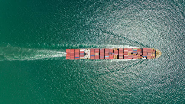 istock cargo container ship sailing full speed in sea to import export goods and distributing products to dealer and consumers worldwide, by container ship Transport business delivery service, aerial view 1598637635