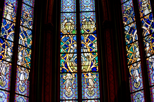 Orleans, France, april 20, 2023 : stained glasses windowsl decors of Cathedral basilica of the holy cross, various artist, 19th century
